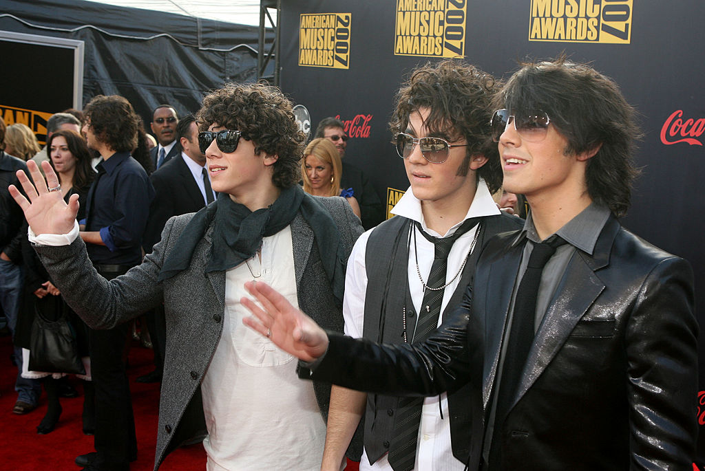 Musicians Nick Jonas, Joe Jonas and Kevin Jonas of the Jonas Brothers arrive at the 2007 American Music Awards held at the Nokia Theatre L.A. LIVE on November 18, 2007 in Los Angeles, California