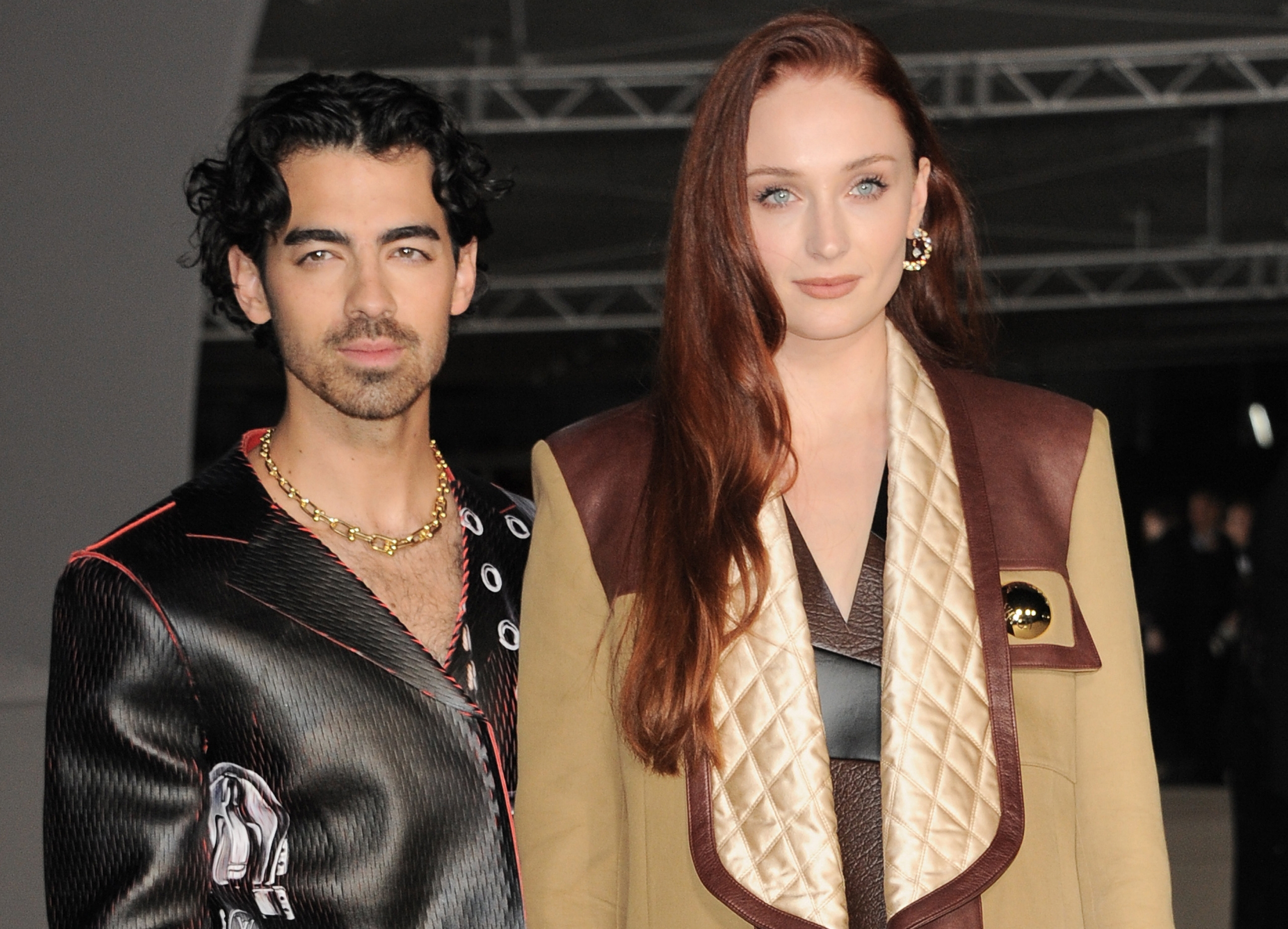 Joe Jonas and Sophie Turner at an event looking at the camera