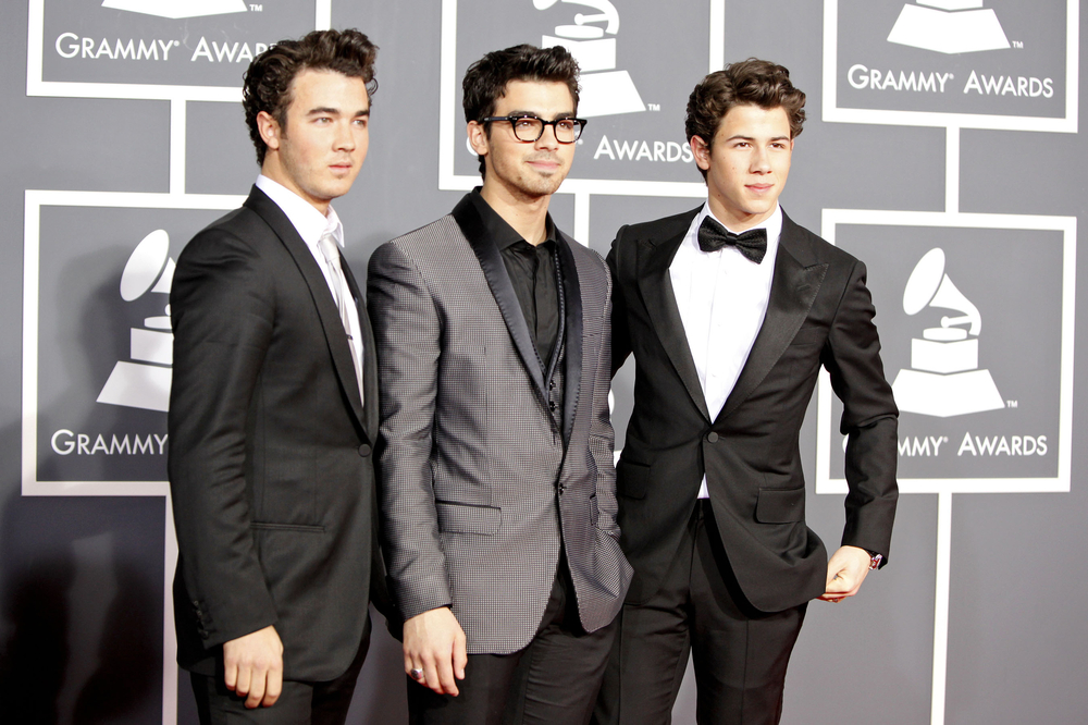Kevin Jonas, Joe Jonas and Nick Jonas arrive at the 52nd Annual GRAMMY Awards