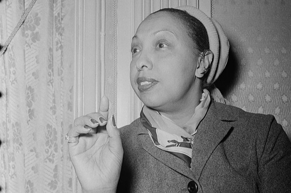 Grayscale portrait photo of elder Josephine Baker wearing a coat