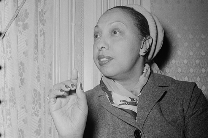 Grayscale portrait photo of elder Josephine Baker wearing a coat