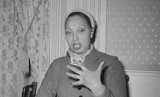 Grayscale portrait photo of elder Josephine Baker wearing a coat