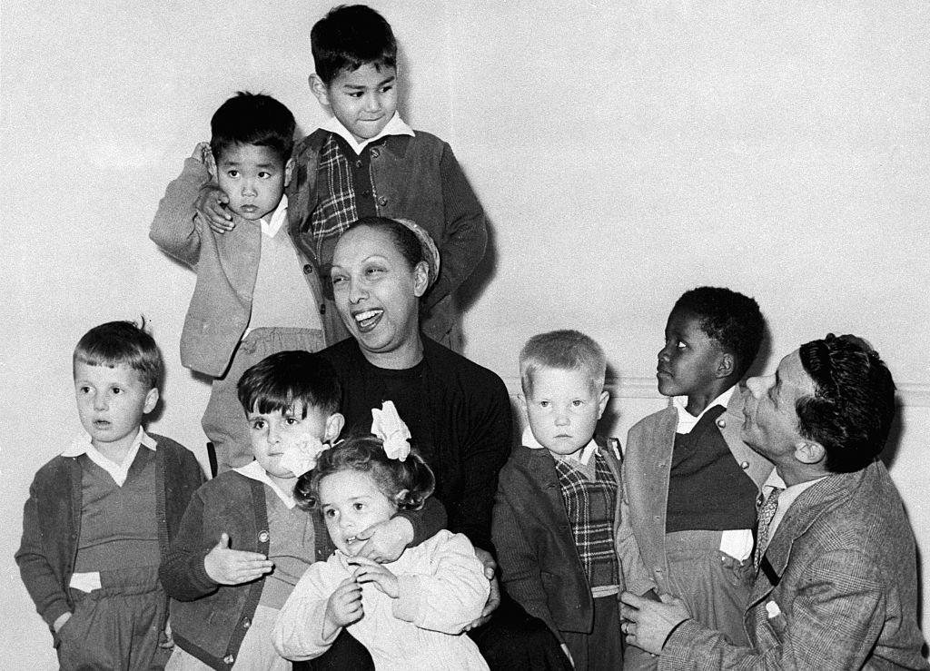 Singer Josephine Baker with her husband Joe Bouillon and their eleven children at their home
