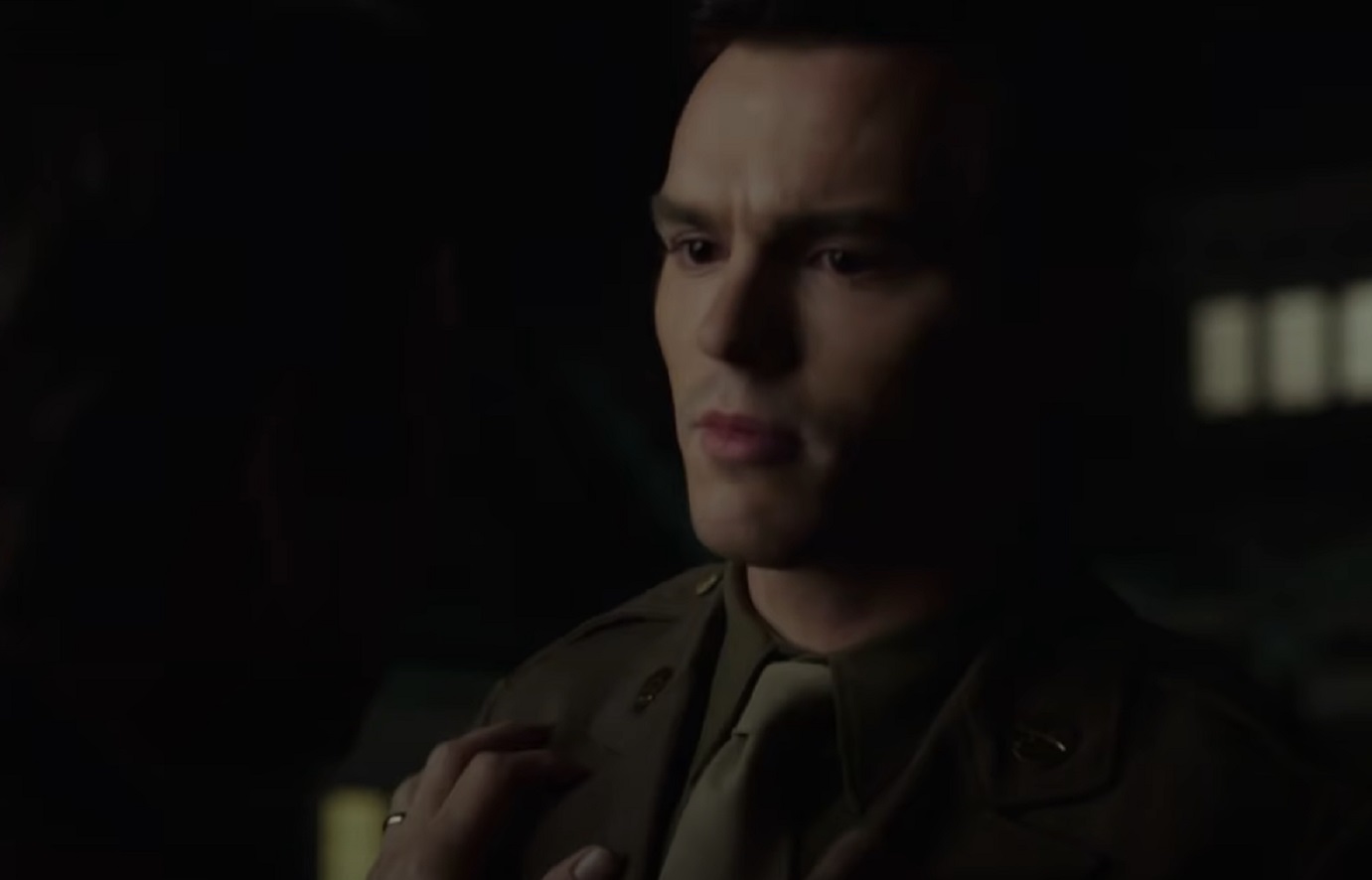 Screenshot: J.D. Salinger wearing dark uniform is looking at side - from Rebel in the Rye (2017)