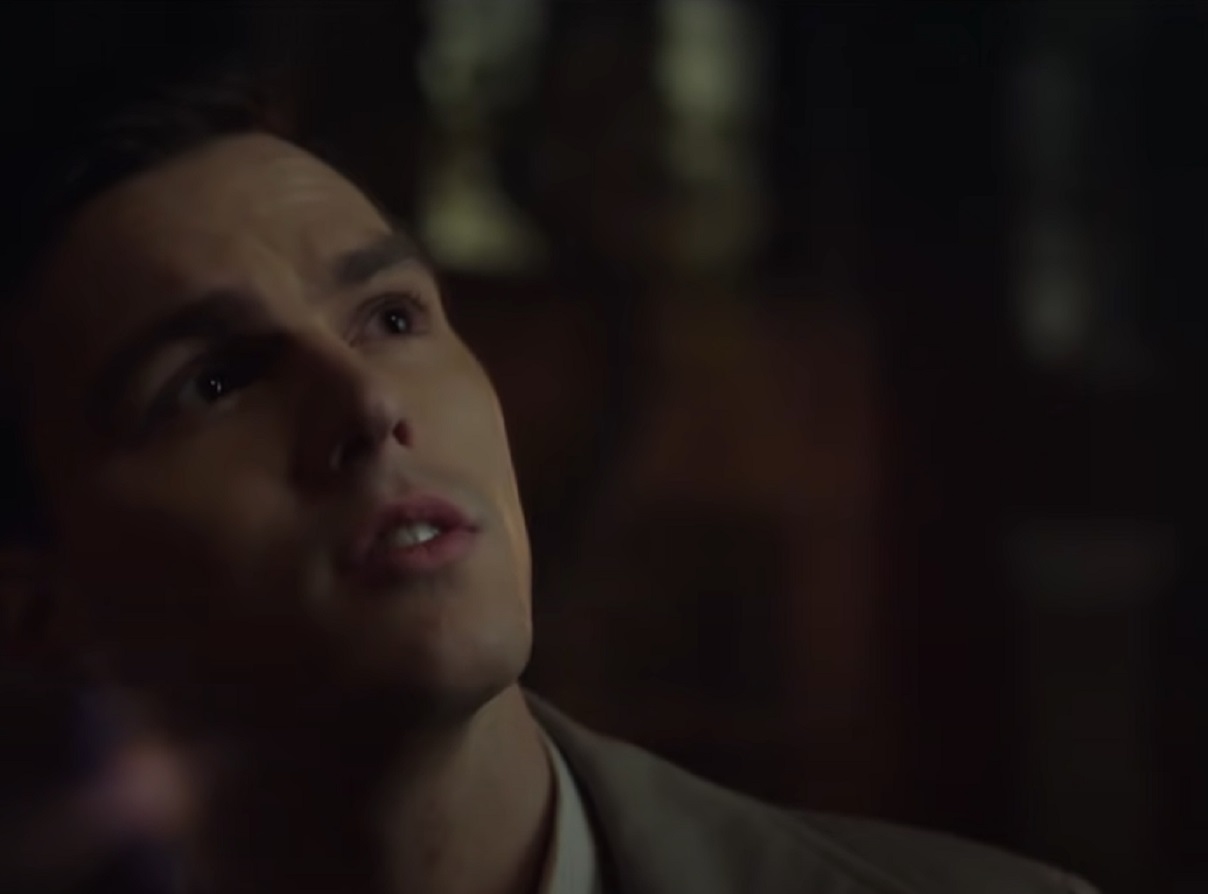 Screenshot: J.D. Salinger wearing dark suit is looking up - from Rebel in the Rye (2017)