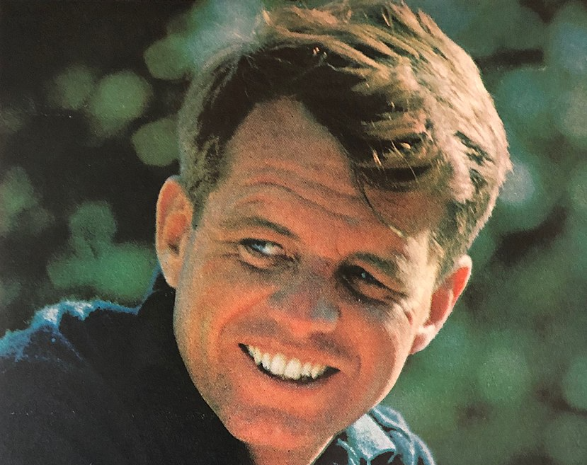 Portrait Photo Of  Robert F. Kennedy wearing dark blue shirt smiling facing the camera