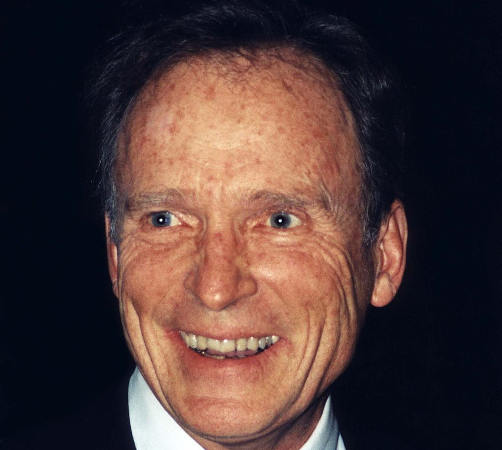 Portrait Photo Of Dick Cavett wearing  black suit white shirt and a tie