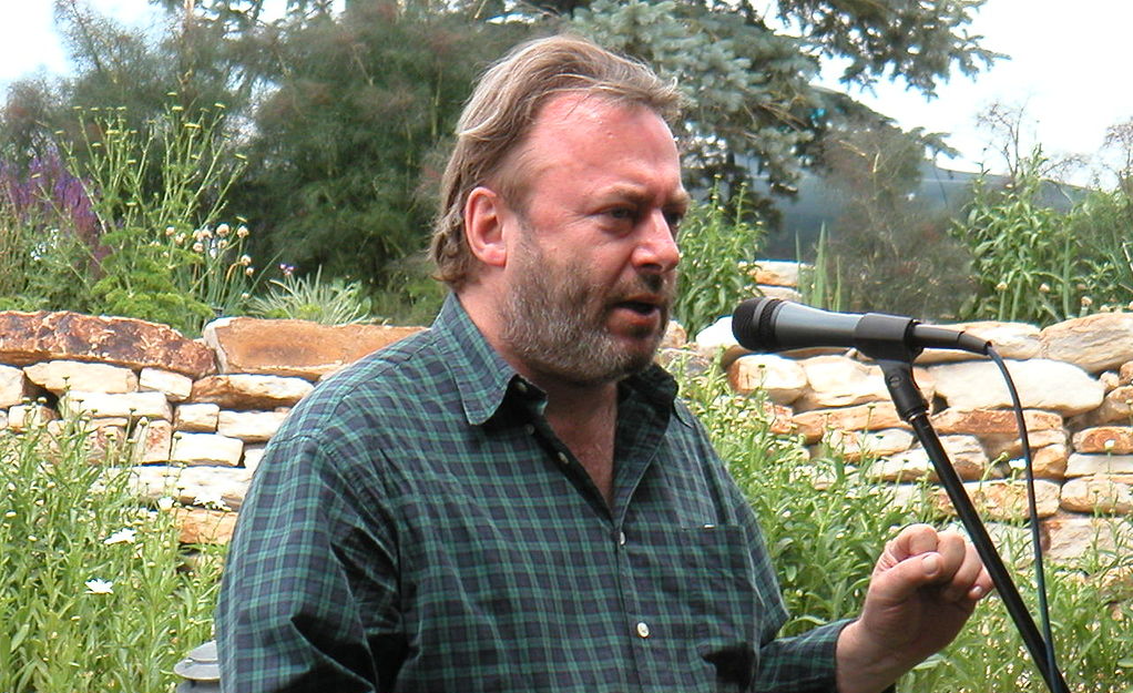 British author and journalist Christopher Hitchens giving a speech for the ATF Party wearing a green shirt