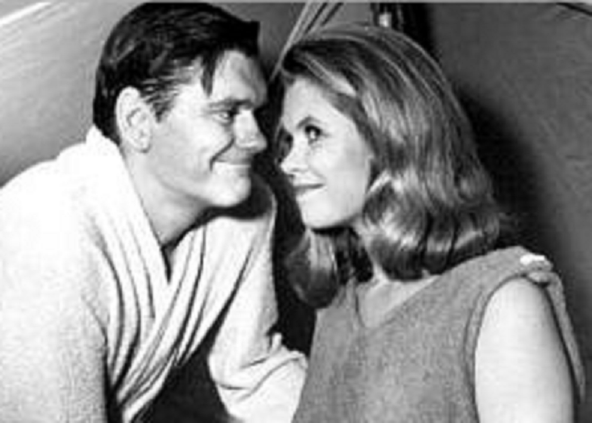 B&W portrait of Dick York & Elizabeth Montgomery looking at camera.