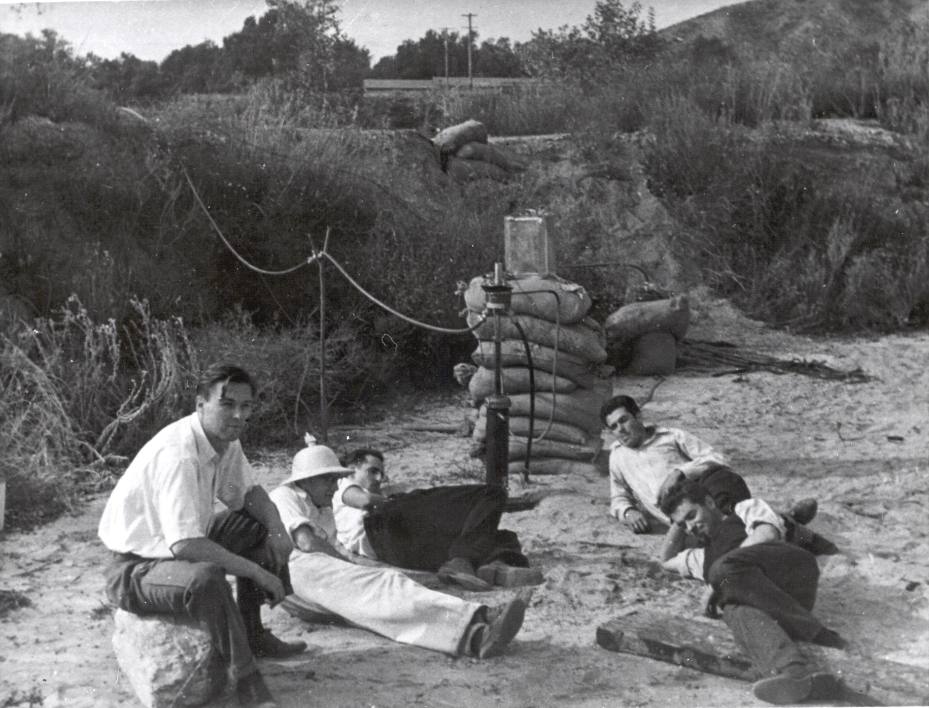 In the Arroyo Seco; seated left to right: Rudolph Schott, Apollo Milton Olin Smith, Frank Malina (white shirt, dark pants), Ed Forman and Jack Parsons
