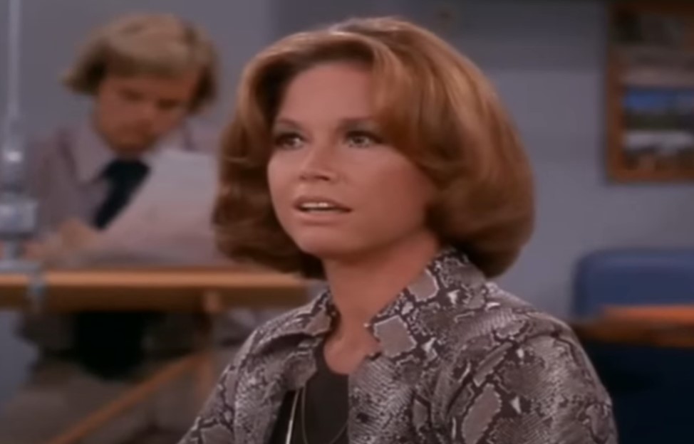 Mary Tyler Moore in  The Mary Tyler Moore Show sitting at desk