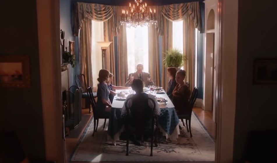 Jack Reynor as Jack Parsons in  Strange Angel sitting on a chair