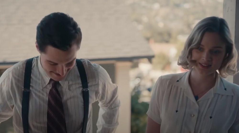 Jack Reynor as Jack Parsons in  Strange Angel sitting at meal with wife Susan Parsons