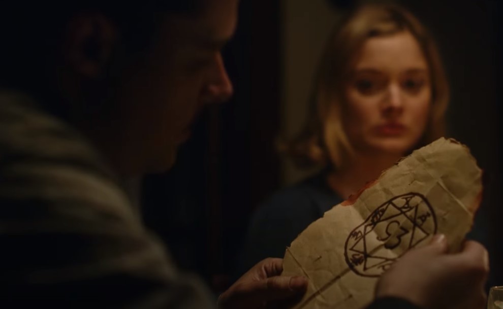 Jack Reynor as Jack Parsons in  Strange Angel sitting at meal with wife Susan Parsons