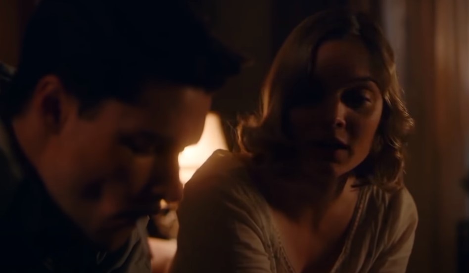 Jack Reynor as Jack Parsons in  Strange Angel sitting at meal with wife Susan Parsons