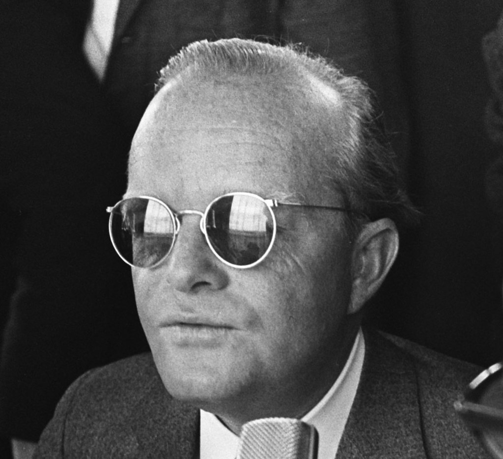Grayscale Portrait Photo Of The Writer Truman Capote wearing sunglasses