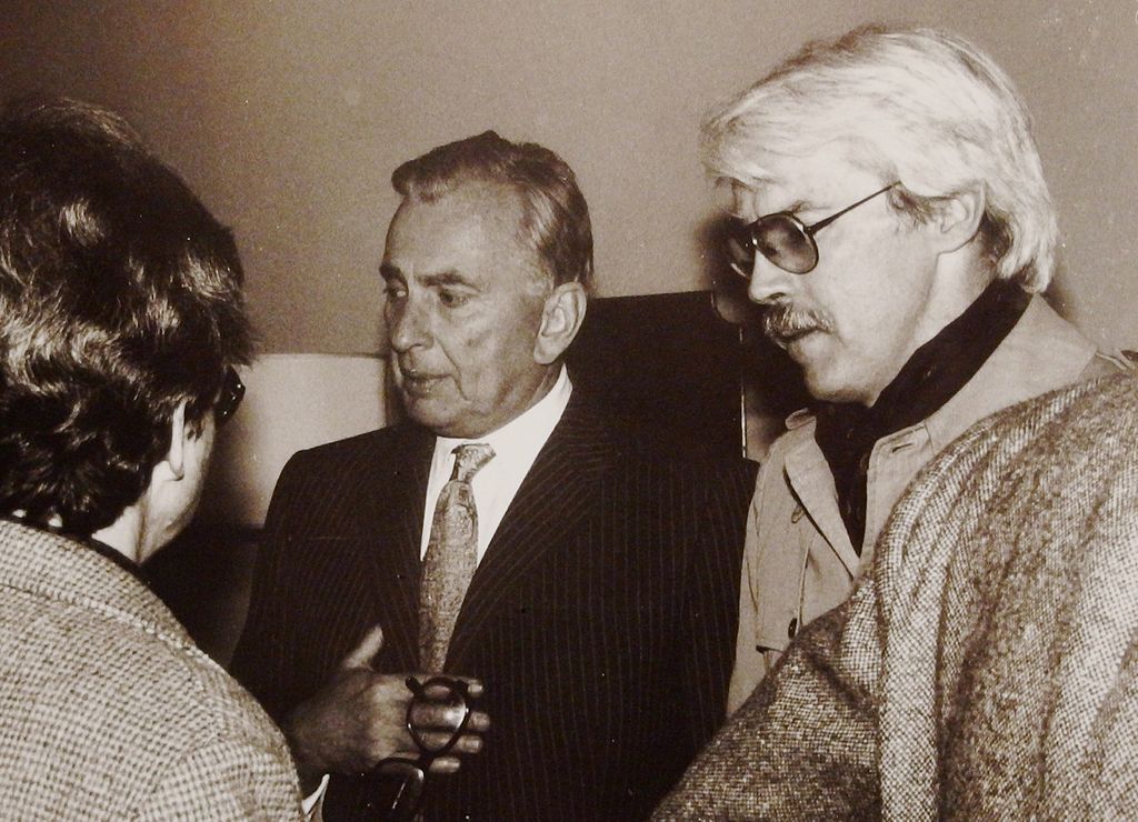 American authors Gore Vidal and Michael Mewshaw conversing at a party at Vidal's home