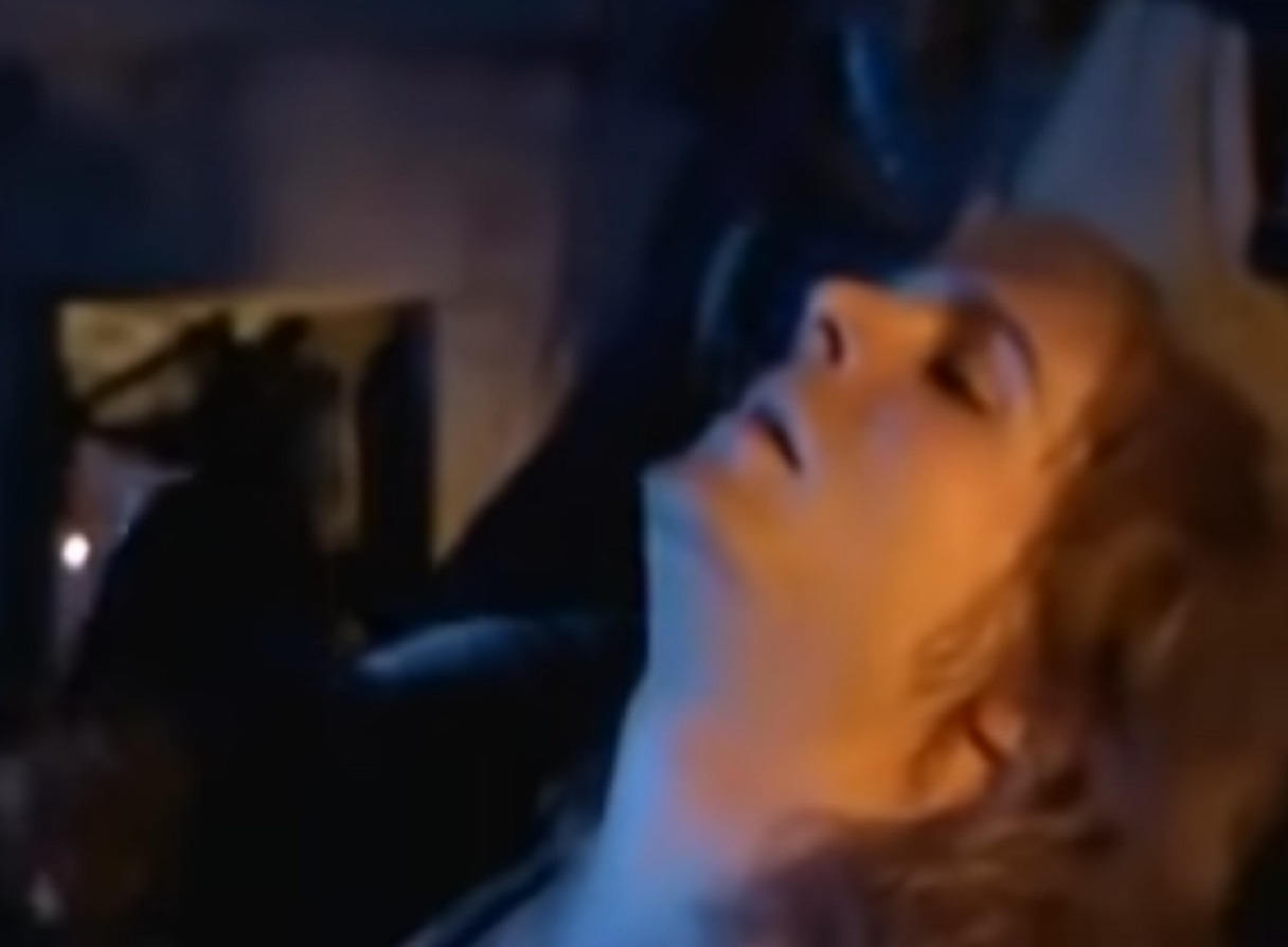 Screenshot: (Mark Umbers) Perkin Warbeck with long hair is laying sad and looking up - from Princes in the Tower (2005).