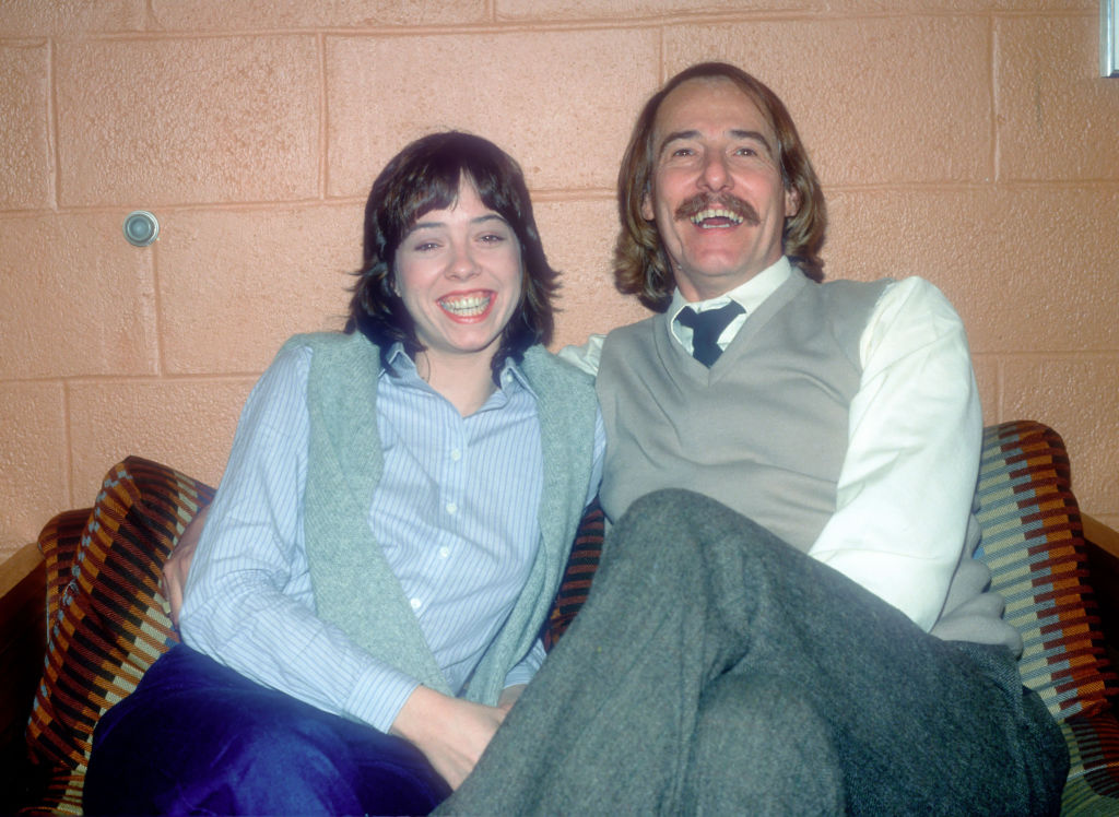 John Phillips poses for a photograph December 1, 1980 with his daughter MacKenzie