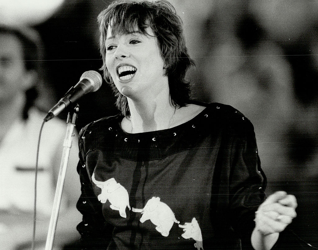 Mackenzie Philips singing in black top