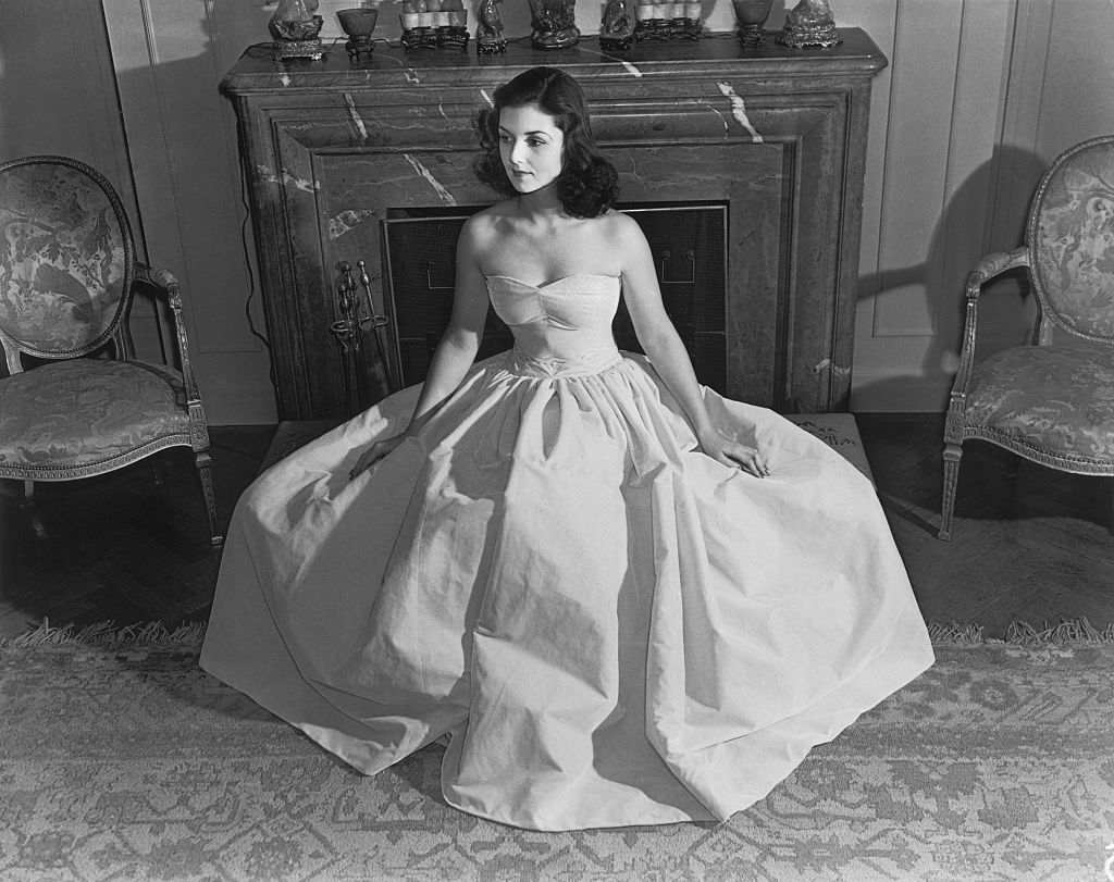 Grayscale Portrait Photo of Brenda Frazier wearing a long white dress looking to the left