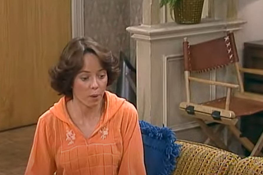 Mackenzie Phillips in One Day at a Time  sitting on couch
