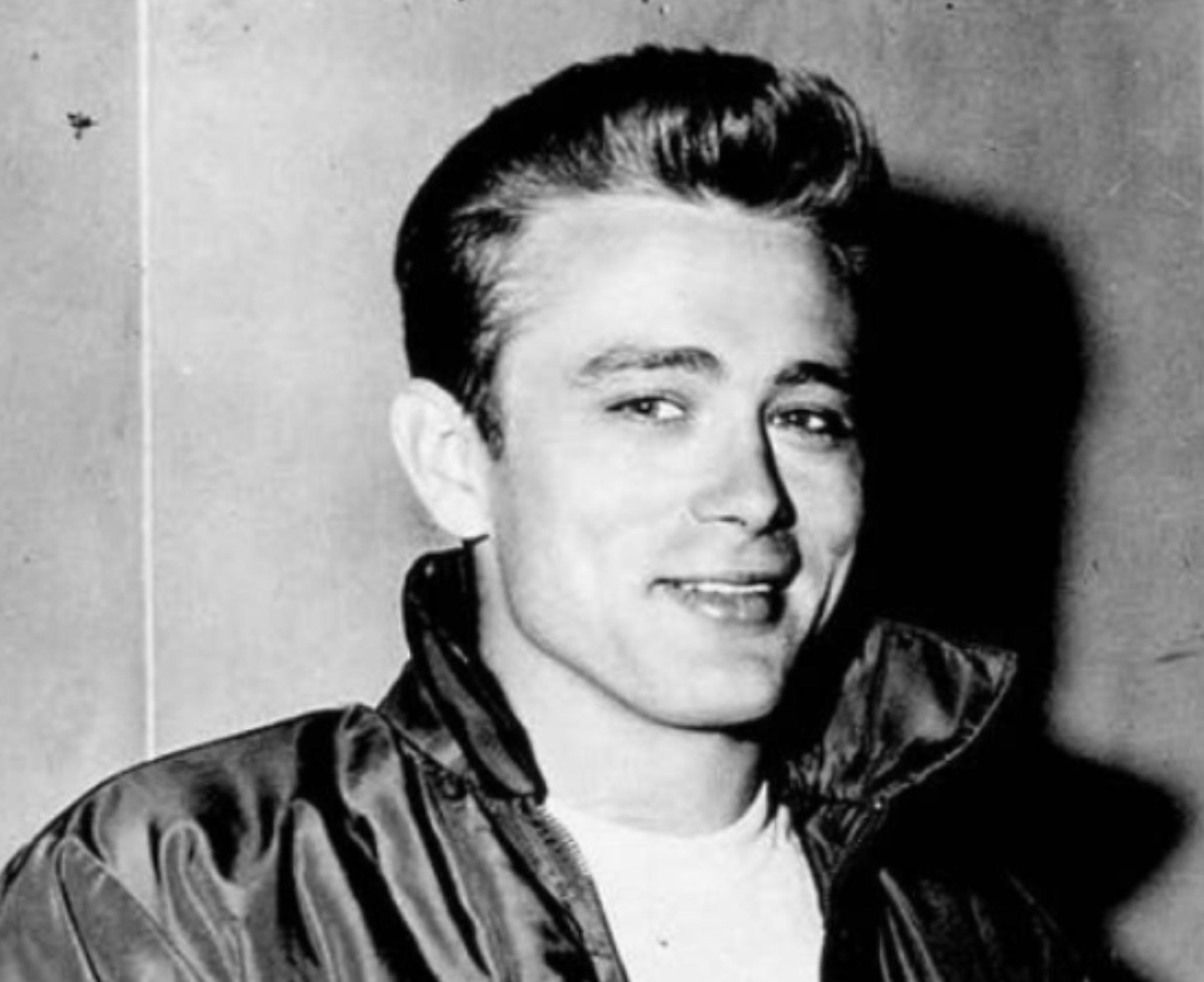 B&W photo of James Dean - rare pose for a fan.