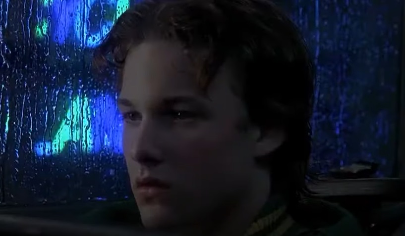 Screenshot of the actor Brad Renfro from the Movie Apt Pupil (1995) depicting a teenager, facing the camera