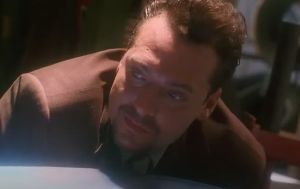 Tom Sizemore  in Natural Born Killers wearing brown jacket