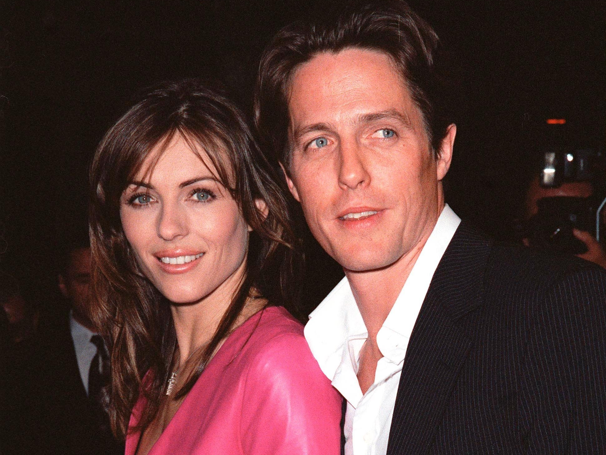 Actor HUGH GRANT & actress/model/producer girlfriend ELIZABETH HURLEY at the Los Angeles premiere of their new movie 