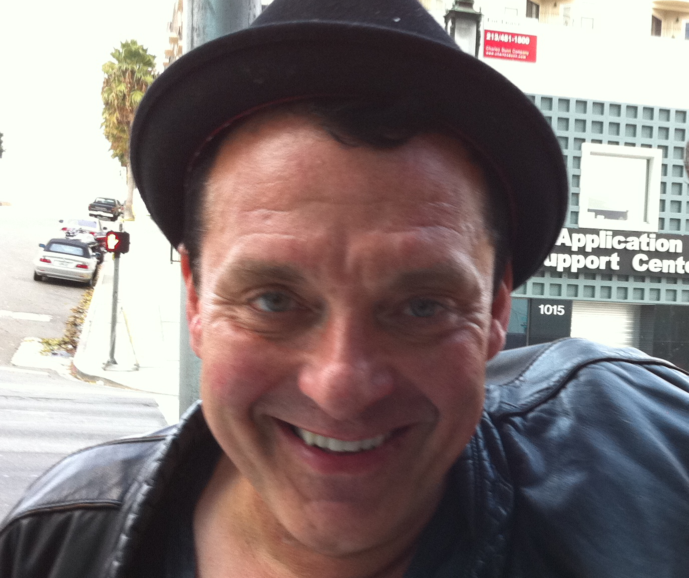 om Sizemore in black leather jacket and hat