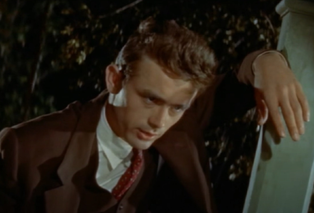 Screenshot: photo of James Dean standing outside with upset face - from the East Of Eden (1955).
