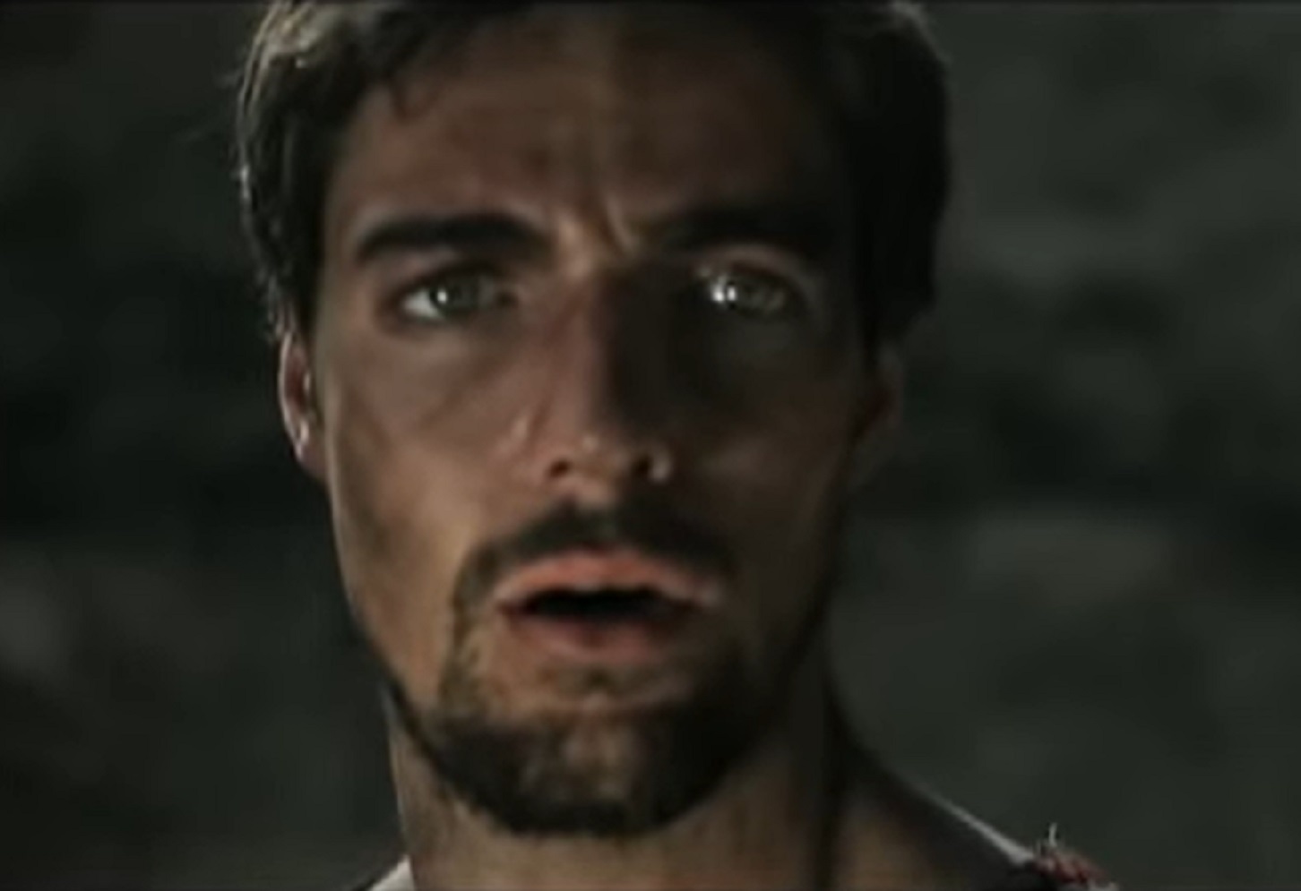 Screenshot: Richard I wearing animal skin as coat and looking at side from - Richard the Lionheart (2013)