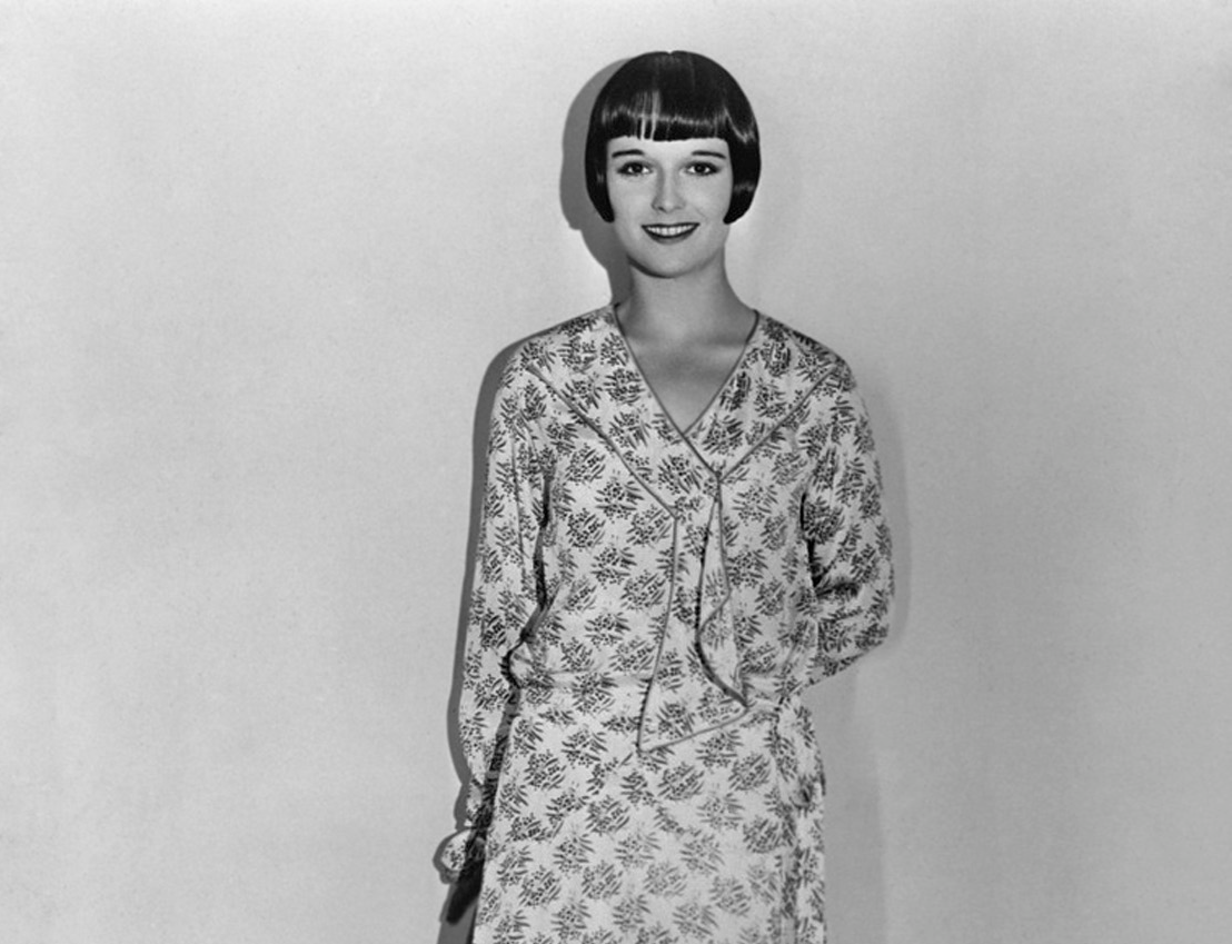 Louise Brooks, in a circular skirted frock that adopts black and yellow designs