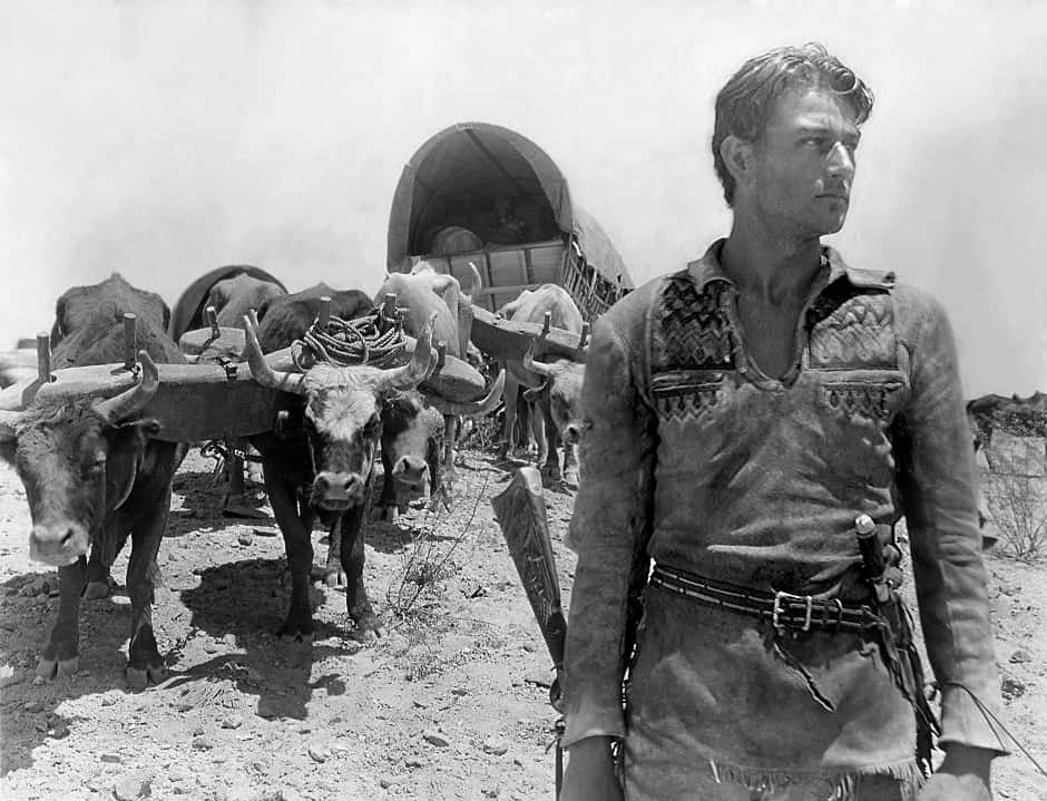 ortrait Photo of the actor John Wayne in the movie The Big Trail, wearing cowboy outfit
