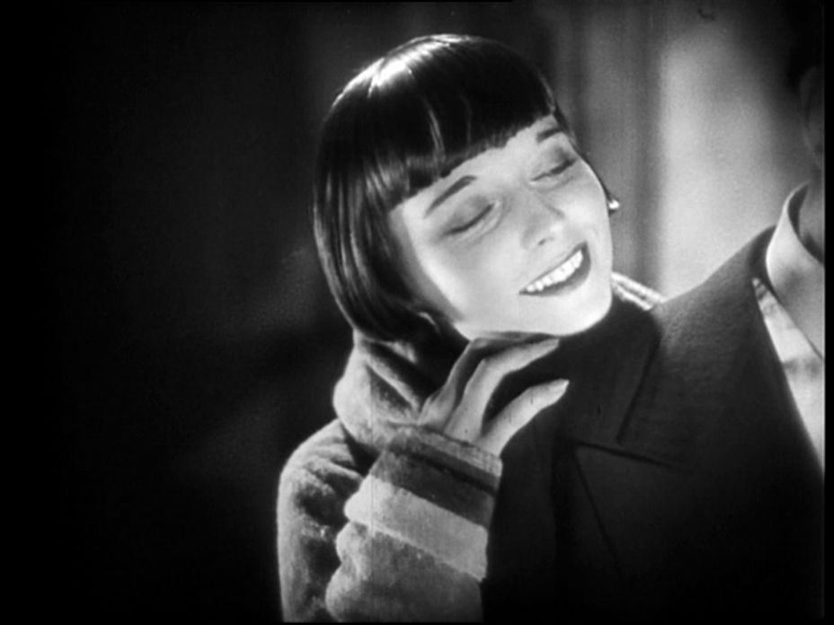 Grayscale Portrait Photo of the actress Louise Brooks from the movie Pandora's Box, smiling
