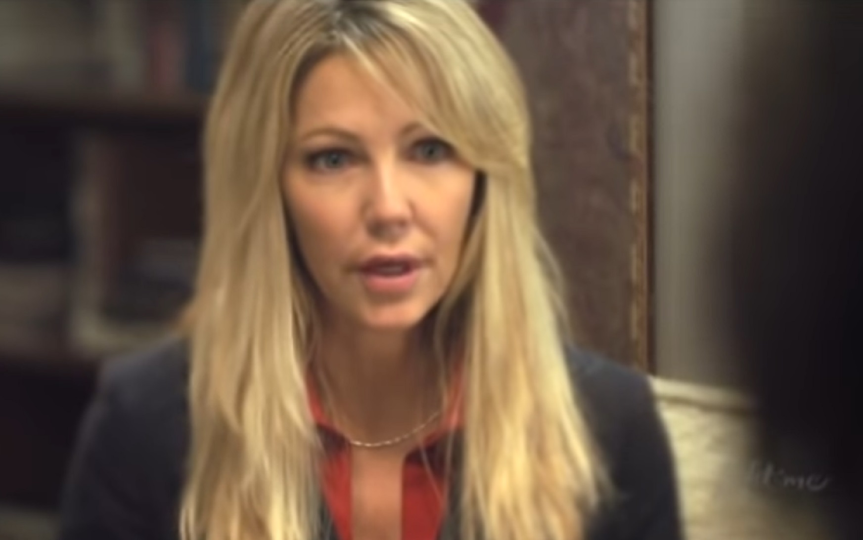 Screenshot of Heather Locklear wearing black suit - from Fade to Black (1993)