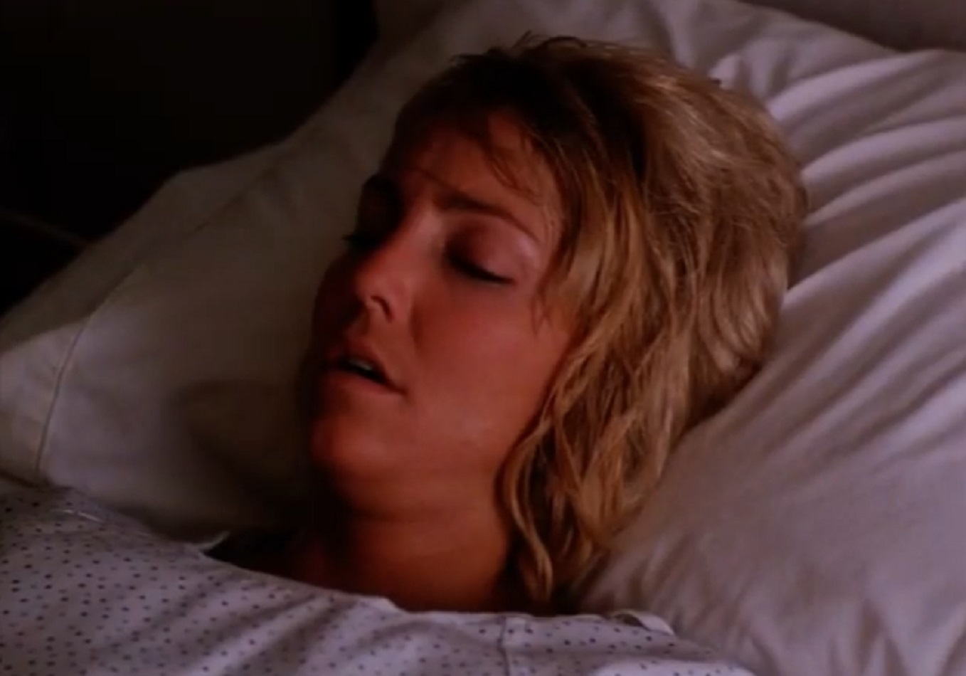 Screenshot of Heather Locklear laying at hospital bed - from Texas Justice (1995)