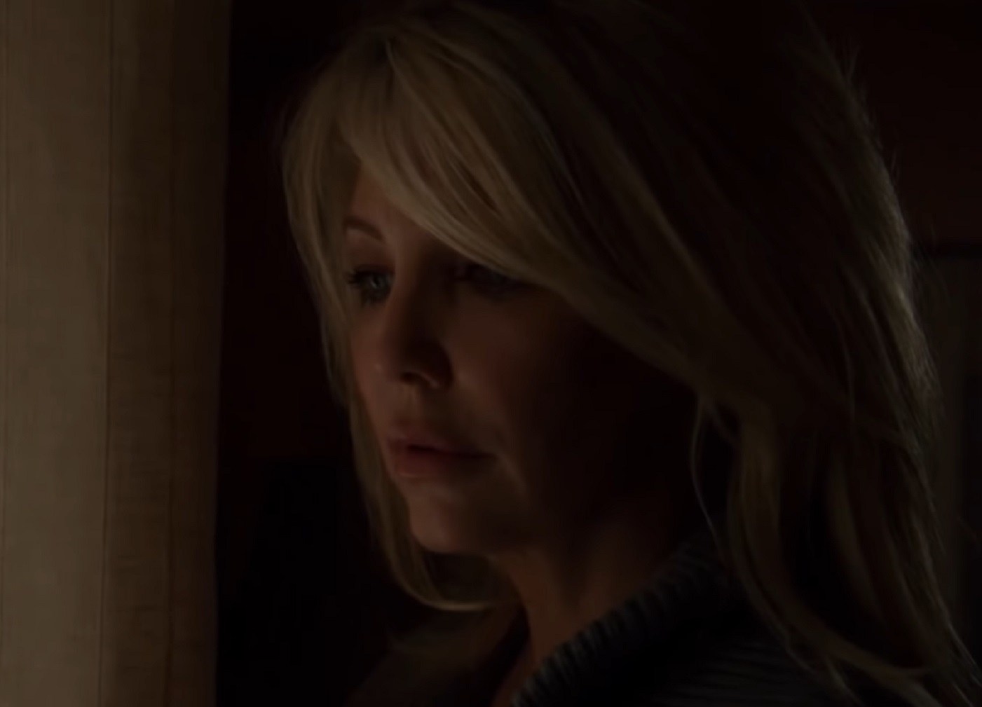 Screenshot of Heather Locklear looking from the window - from Flying By (2009)