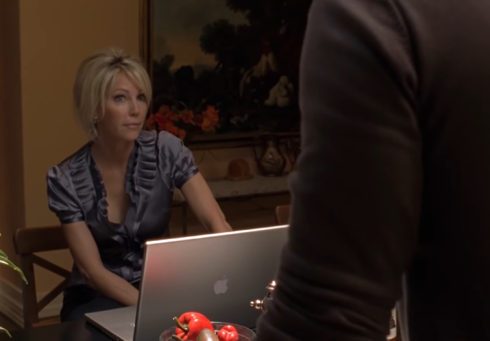 Screenshot of Heather Locklear looking at laptop and talking - from Flying By (2009)