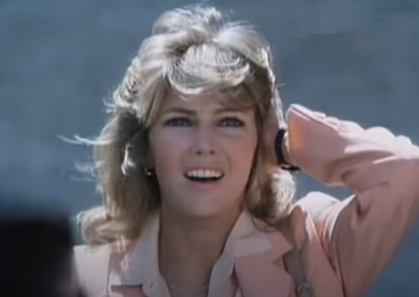 Screenshot of Heather Locklear wearing pink jacket is looking surprised - from City Killer (1984)