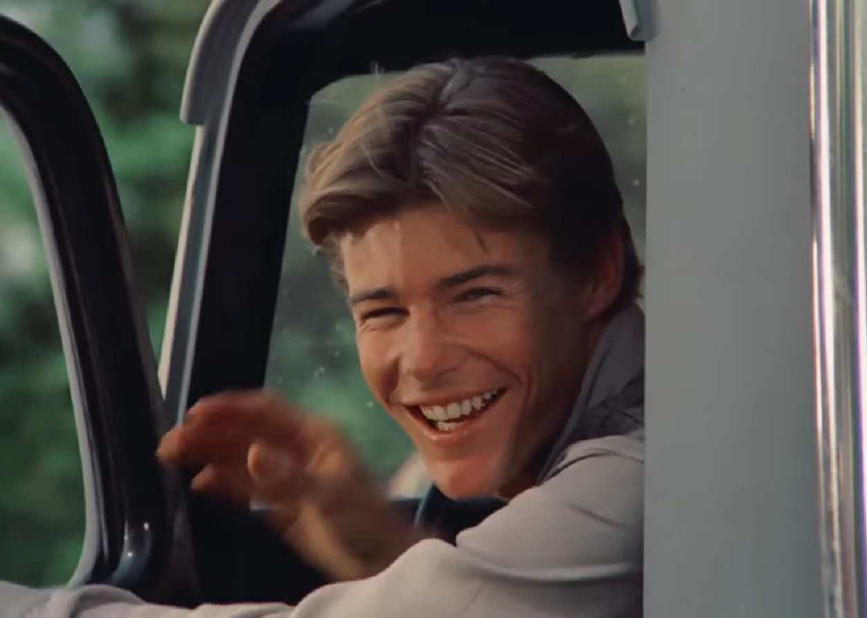 Screenshot: Jan-Michael Vincent wearing white shirt is smiling - from Buster and Billie (1974)