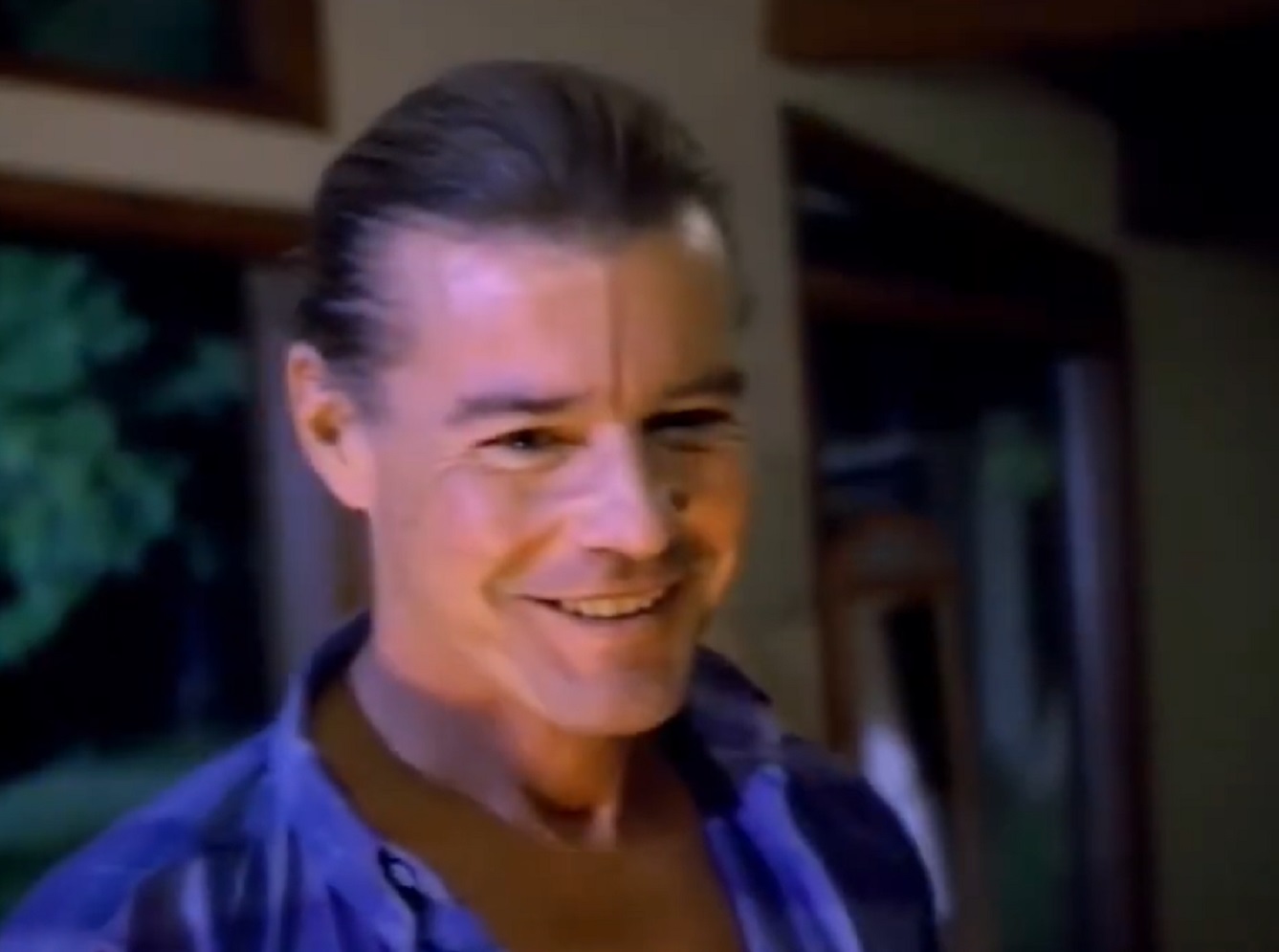 Screenshot: Jan-Michael Vincent wearing blue shirt is looking down - from Xtro Ii- The Second Encounter (1991)