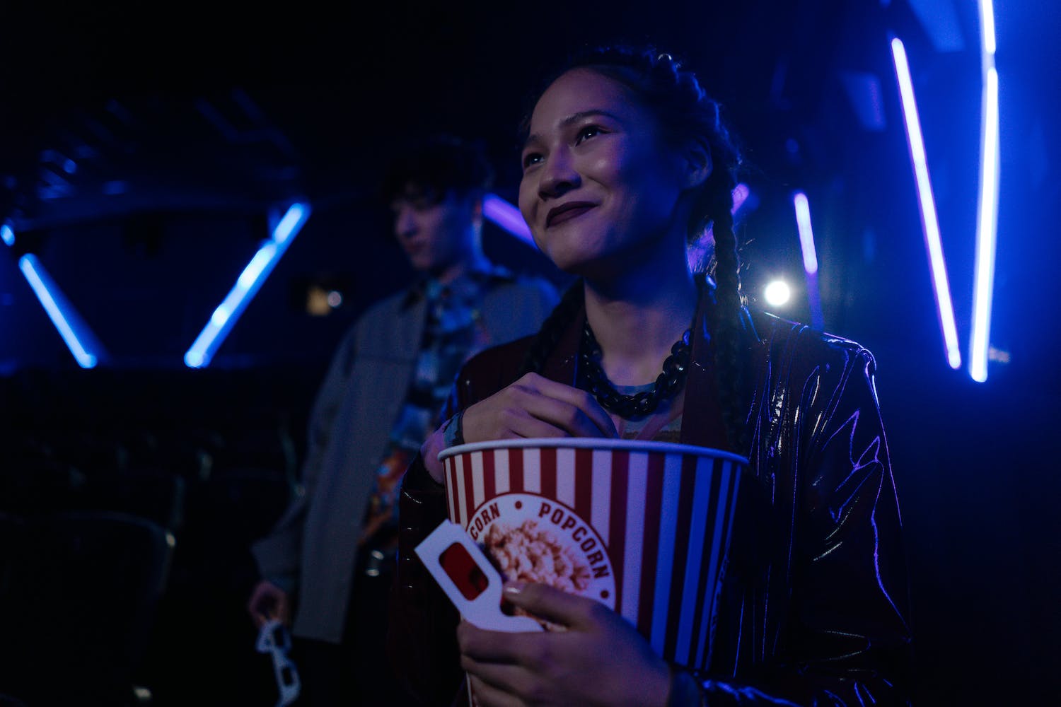 Woman Inside the Movie Theater Holding a Popcorn Bucket