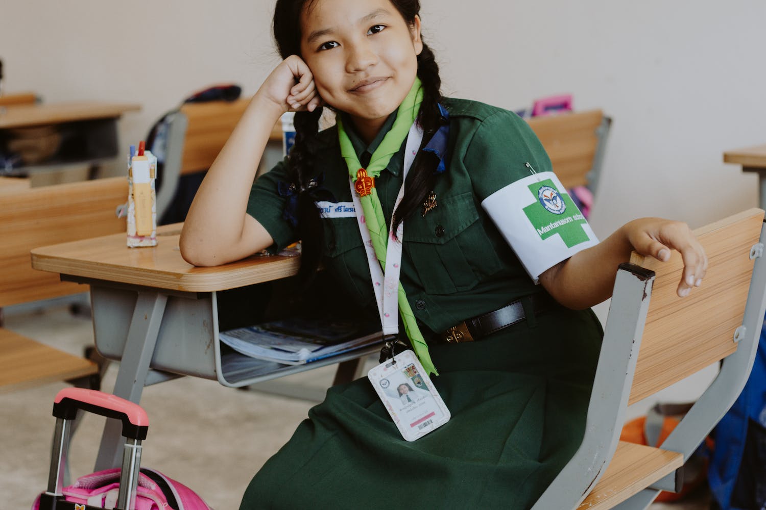Girl Scout Student sitting on a Wooden Chair