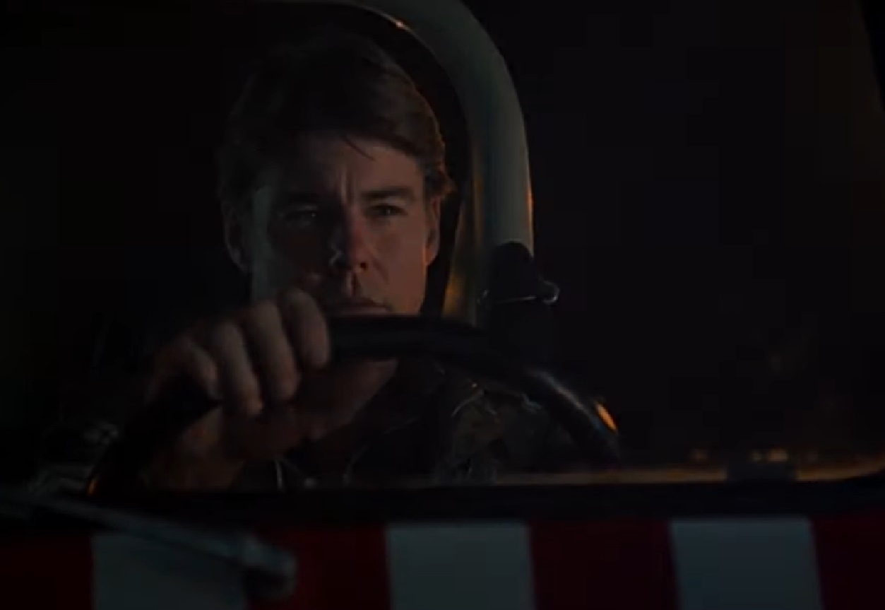 Screenshot: Jan-Michael Vincent wearing black leather jacket is driving a car - from  Airwolf (1984/86)