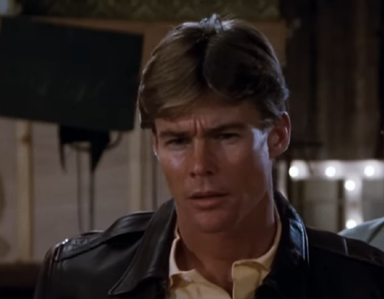 Screenshot: Jan-Michael Vincent wearing black jacket is looking sad - from Hooper (1978)