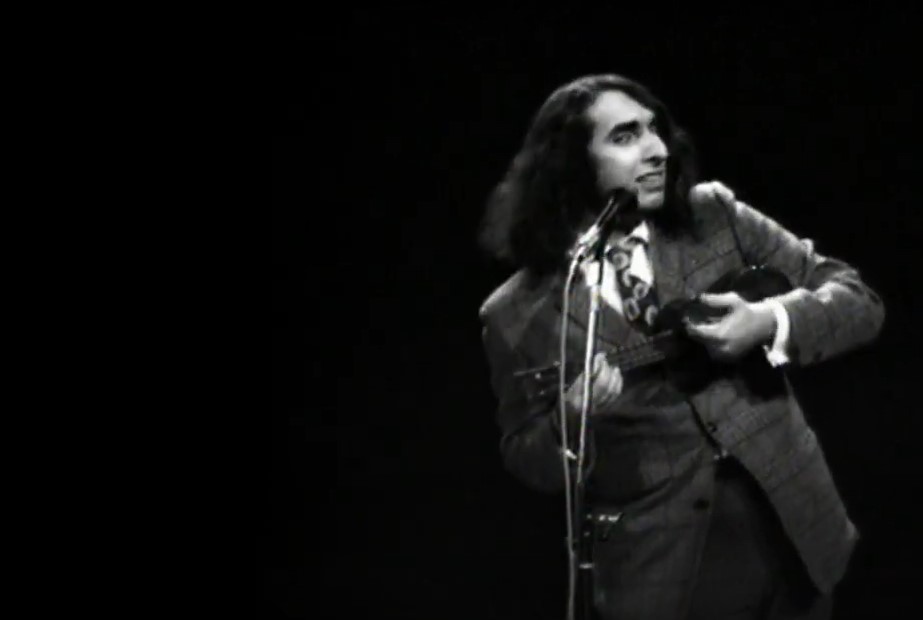 Tiny Tim playing instrument and singing