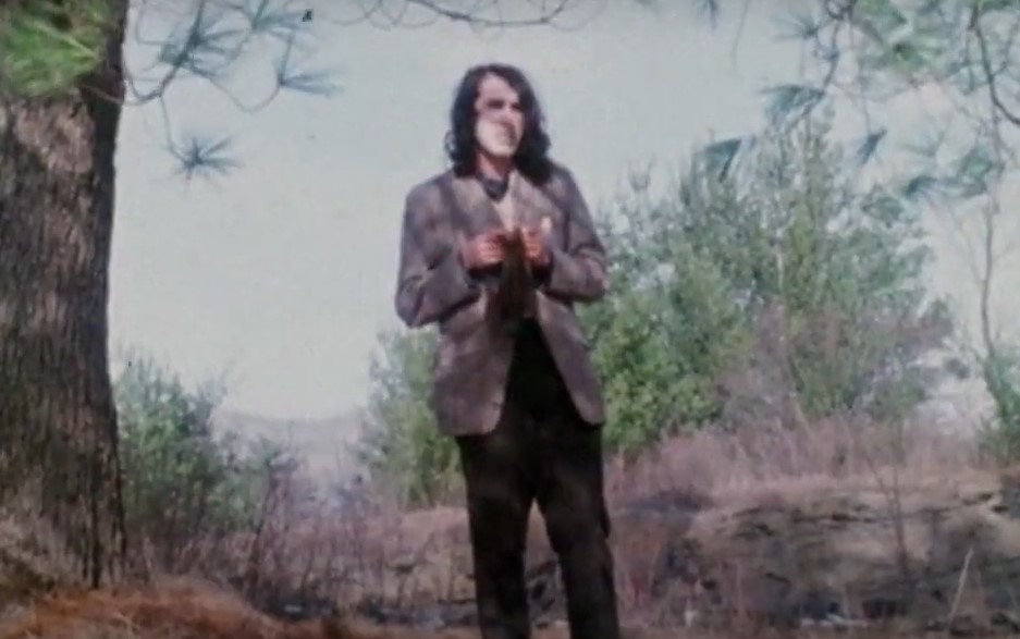 Tiny Tim singing outside