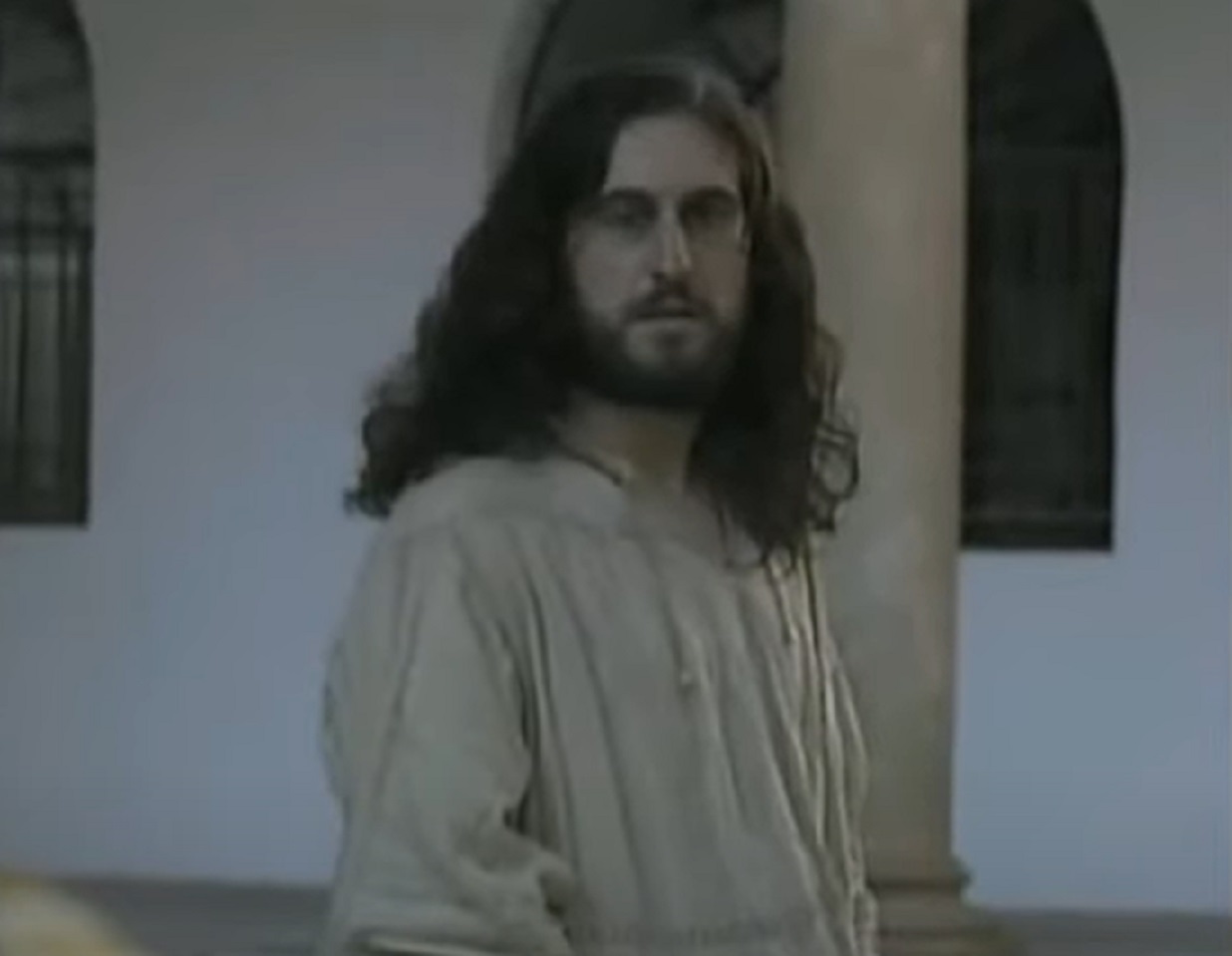 Screenshot of Charles VIII of France with long hair and white shirt is walking outside - from Isabel (2011-2014)